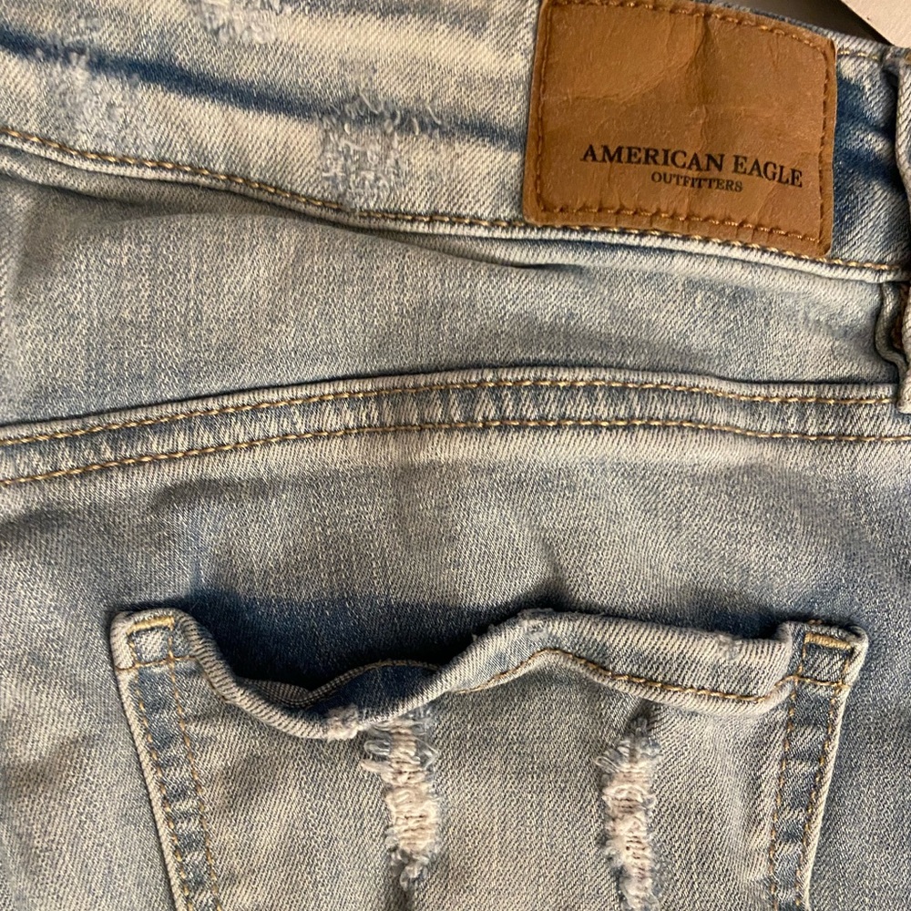 Light blue extremely ripped American Eagle jeans